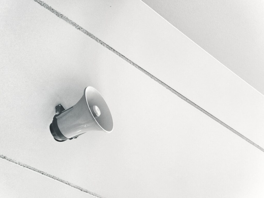 A white megaphone on a white background